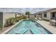 Backyard pool featuring built-in lounge chairs and outdoor seating at 12048 E Chevelon Trl, Gold Canyon, AZ 85118