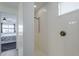 This bathroom has a pristine white tiled shower and a bedroom view at 12048 E Chevelon Trl, Gold Canyon, AZ 85118