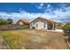 Spacious backyard featuring a covered patio and well-maintained landscaping at 12543 W Roanoke Ave, Avondale, AZ 85392