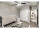 Neutral bedroom features a ceiling fan and closet, offering comfortable living with bright natural light at 12543 W Roanoke Ave, Avondale, AZ 85392