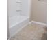 Clean bathroom with a shower-tub combination and neutral tile flooring at 1255 N Arizona Ave # 1216, Chandler, AZ 85225