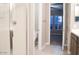 A bathroom showing the toilet, shower, and sink with a view to the bedroom at 1255 N Arizona Ave # 1216, Chandler, AZ 85225
