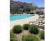 Inviting community pool with sun loungers, surrounded by lush greenery and well-maintained landscaping at 1255 N Arizona Ave # 1216, Chandler, AZ 85225