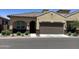 Inviting home exterior showcasing a tile roof, a two car garage, and well-manicured landscaping at 1255 N Arizona Ave # 1216, Chandler, AZ 85225