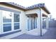 Home exterior featuring a patio, sliding glass doors, and windows with a view to the back yard at 1255 N Arizona Ave # 1216, Chandler, AZ 85225