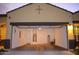 A two car garage with an automatic door opener, water heater, and ladder at 1255 N Arizona Ave # 1216, Chandler, AZ 85225