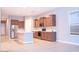 A kitchen featuring stainless steel appliances, an island, and wooden cabinets at 1255 N Arizona Ave # 1216, Chandler, AZ 85225