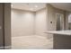 A living room showing tile floors, recessed lighting, and neutral colored walls at 1255 N Arizona Ave # 1216, Chandler, AZ 85225