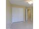 Bright bedroom features white closet doors and a ceiling fan at 135 S Verde Ln, Casa Grande, AZ 85194