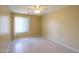Bedroom with tile floors, ceiling fan, neutral walls, and a window with blinds at 135 S Verde Ln, Casa Grande, AZ 85194