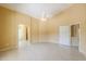 Bedroom features neutral tile flooring and access to the en-suite bathroom at 135 S Verde Ln, Casa Grande, AZ 85194