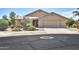 Charming single-story home featuring a well-maintained yard and a two-car garage at 135 S Verde Ln, Casa Grande, AZ 85194