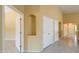 Hallway featuring a built-in alcove and access to multiple rooms at 135 S Verde Ln, Casa Grande, AZ 85194