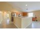 Well-lit kitchen featuring a breakfast bar, stainless steel appliances, and ample cabinet space at 135 S Verde Ln, Casa Grande, AZ 85194
