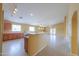 Open kitchen with breakfast bar overlooking a large living space, and stainless steel appliances at 135 S Verde Ln, Casa Grande, AZ 85194