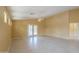 Bright open living area with tiled floors, high ceiling and access to outdoor patio at 135 S Verde Ln, Casa Grande, AZ 85194
