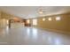 Open floorplan with tile floors, neutral walls, and a view to the kitchen at 135 S Verde Ln, Casa Grande, AZ 85194