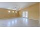 Bright, spacious living room featuring tile floors, high ceiling and neutral walls at 135 S Verde Ln, Casa Grande, AZ 85194