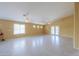 Spacious living room with neutral walls, tile flooring, and abundant natural light at 135 S Verde Ln, Casa Grande, AZ 85194