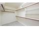 Spacious walk-in closet with wood trim shelving, offering plenty of storage solutions at 135 S Verde Ln, Casa Grande, AZ 85194