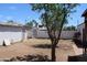 Large backyard featuring a block wall with metal gate at 1367 E Clarendon Ave, Phoenix, AZ 85014