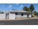 Side view of house, including fenced area and metal grate windows at 1367 E Clarendon Ave, Phoenix, AZ 85014