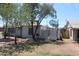 Side view of house, including fenced area with a satellite dish on the roof at 1367 E Clarendon Ave, Phoenix, AZ 85014