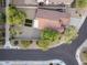 Aerial view of a property featuring a red-tiled roof, desert landscaping, and a well-maintained yard with artificial turf at 14945 N 102Nd St, Scottsdale, AZ 85255