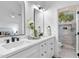 Elegant main bathroom with dual sinks, modern fixtures, and a beautifully tiled walk-in shower at 14945 N 102Nd St, Scottsdale, AZ 85255