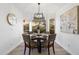 Cozy dining area bathed in natural light with a round table and views of the landscape at 14945 N 102Nd St, Scottsdale, AZ 85255