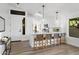 Bright, eat-in kitchen with white cabinets, quartz countertops, and a breakfast bar with seating at 14945 N 102Nd St, Scottsdale, AZ 85255