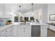 Open-concept kitchen featuring a breakfast bar, stainless steel appliances, and seamless flow to living area at 14945 N 102Nd St, Scottsdale, AZ 85255