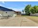 Spacious backyard with a large concrete patio, ideal for outdoor dining and relaxation at 1511 E Harmony Ave, Mesa, AZ 85204