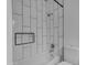 Bathroom featuring a tub and shower with white subway tiles at 1511 E Harmony Ave, Mesa, AZ 85204