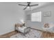 Neutral room with rocking chair, decor and wood look floors at 1511 E Harmony Ave, Mesa, AZ 85204