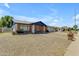 Traditional single story brick home with blue sky and charming walkway at 1511 E Harmony Ave, Mesa, AZ 85204