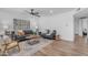 Bright living room features hardwood floors and cozy seating arrangements at 1511 E Harmony Ave, Mesa, AZ 85204