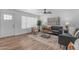 Inviting living room featuring hardwood floors, modern decor, and ample natural light at 1511 E Harmony Ave, Mesa, AZ 85204