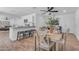 Open concept living space with kitchen, breakfast bar, and dining area at 1511 E Harmony Ave, Mesa, AZ 85204