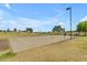 Scenic park featuring a beach volleyball court, lush greenery, and recreational amenities at 1511 E Harmony Ave, Mesa, AZ 85204