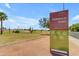 Signage at Emerald Park shows available activities and hours in a verdant Mesa, Arizona setting at 1511 E Harmony Ave, Mesa, AZ 85204