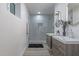 Modern bathroom with double sink vanity, walk-in shower, and sleek design at 1539 W Puget Ave, Phoenix, AZ 85021