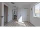 Bright bedroom with hardwood floors, closet, and large window for natural light at 1539 W Puget Ave, Phoenix, AZ 85021