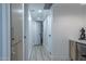 Hallway with a built-in office space, storage cabinets, and neutral décor at 1539 W Puget Ave, Phoenix, AZ 85021