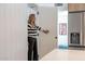 A Personal opens a hidden door in the kitchen, revealing a secret storage space at 1539 W Puget Ave, Phoenix, AZ 85021