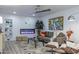 Comfortable living room with a modern fireplace, stylish decor, and ample natural light at 1539 W Puget Ave, Phoenix, AZ 85021