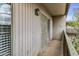Exterior balcony featuring stucco walls, sliding door, wrought iron railing and natural light at 1828 W Tuckey Ln # 13, Phoenix, AZ 85015