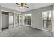Bright bedroom featuring closet with mirrored sliding doors and natural light at 1828 W Tuckey Ln # 13, Phoenix, AZ 85015