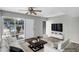 Staged living area with wood-look floors, a ceiling fan, and a bright, airy feel at 1828 W Tuckey Ln # 13, Phoenix, AZ 85015