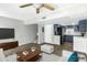 Open-concept living space showcasing the kitchen, living room, and dining area at 1828 W Tuckey Ln # 13, Phoenix, AZ 85015